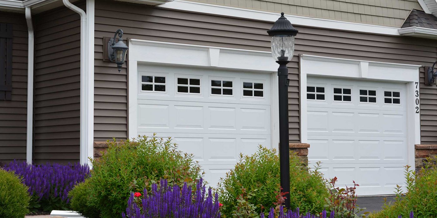 a pair of white residential garage doors