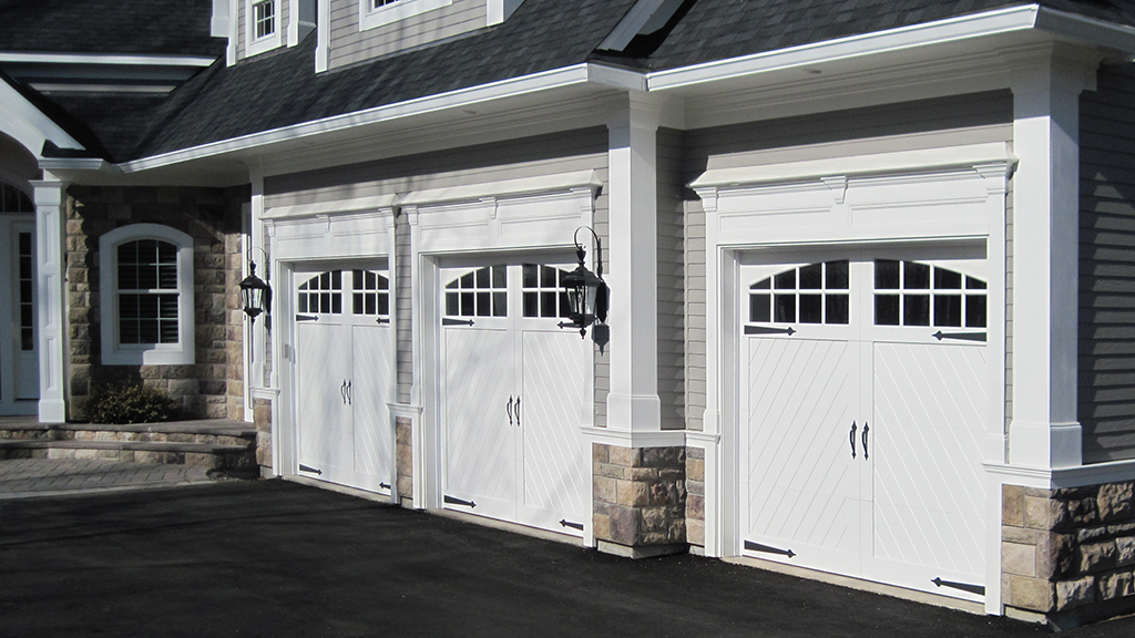 garage with 3 Leakway Custom Garage Doors